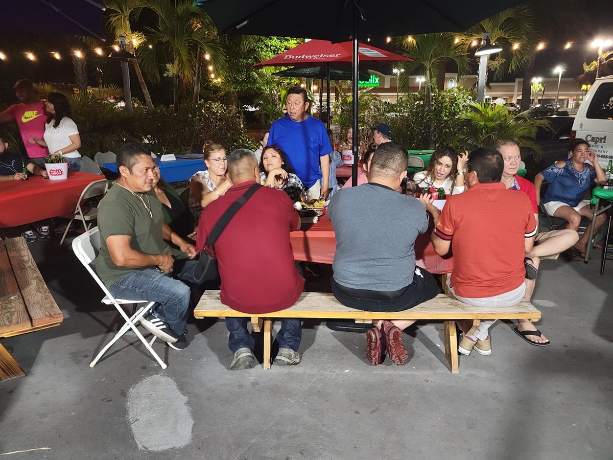 Friends dining at Capri